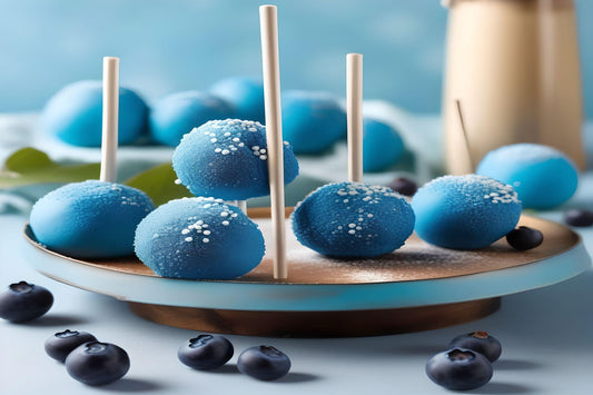 BLUEBERRY CAKE POP - Indulge in a sweet blend of ripe blueberries, candied lemon, and baked dough with Blueberry Cake Pop. Take a bite to enjoy the tempting aroma of this nostalgic treat. A burst of flavor and a playful twist on a classic dessert. Treat yourself (and your taste buds) today!  Available in Perfume Oil & Body Spray